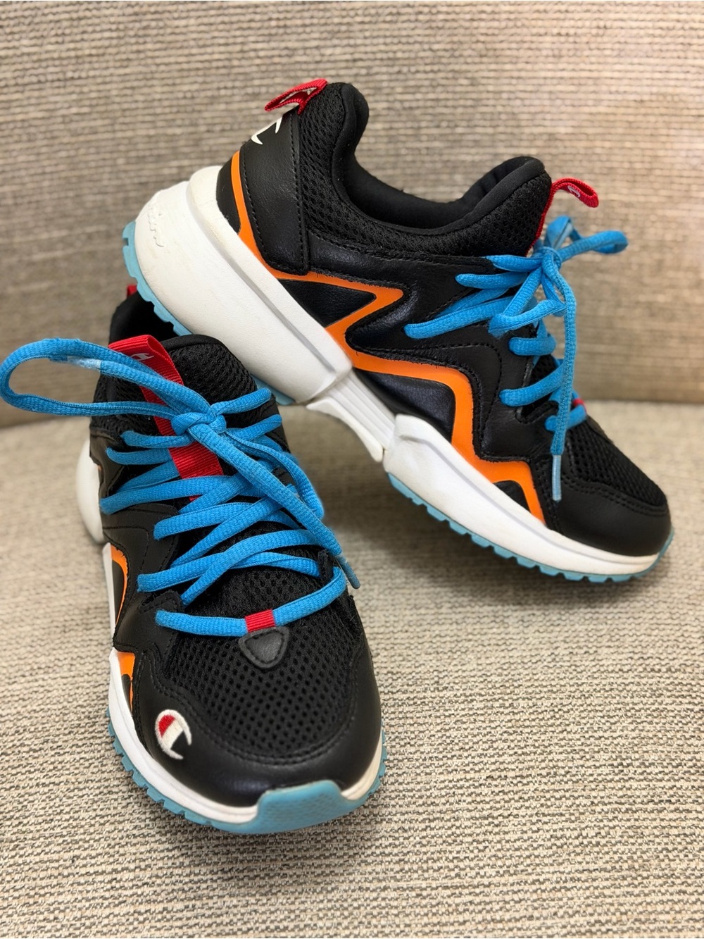 Champion Kids Black Sneakers with Orange Trim and Bright Blue Laces